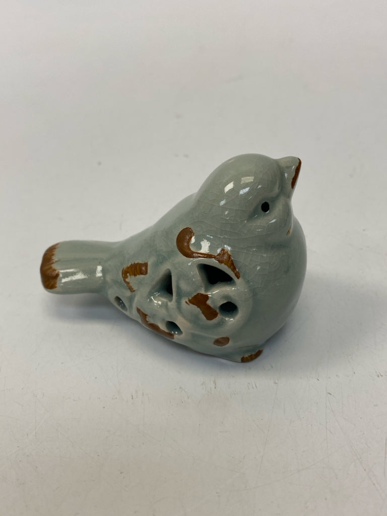 Gray Perforated Ceramic Figurine