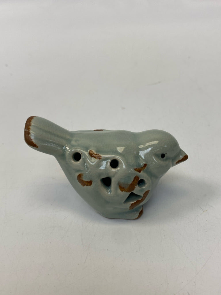 Gray Perforated Ceramic Figurine